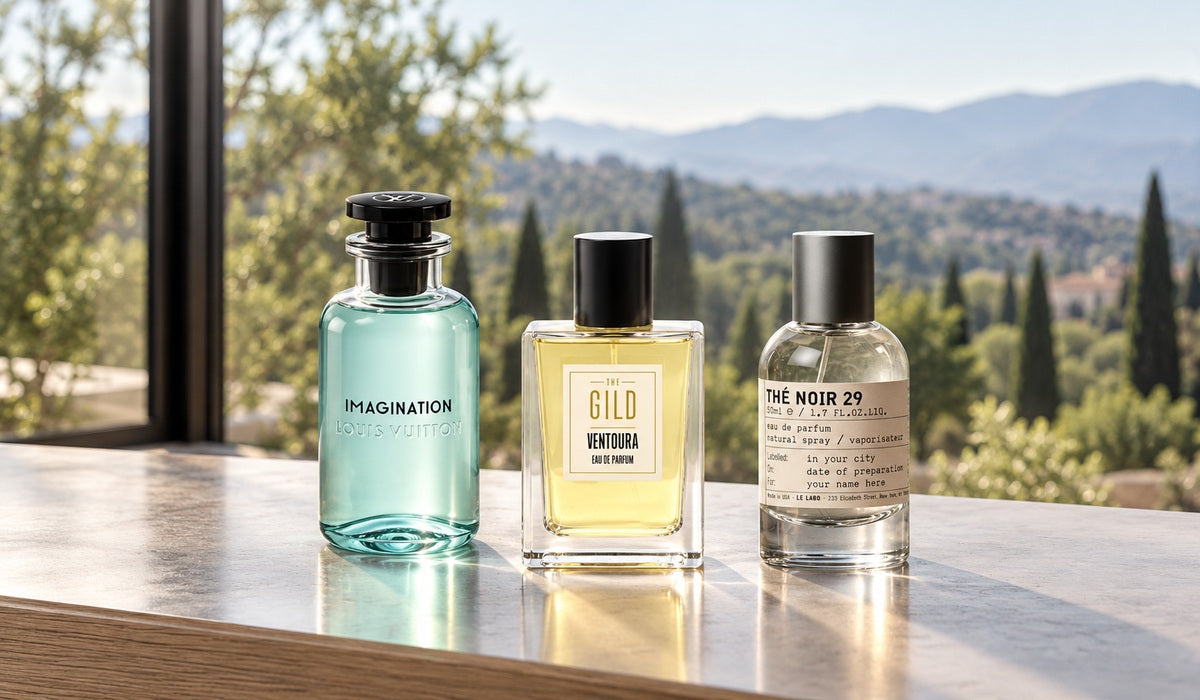 Louis Vuitton Imagination, THE GILD Ventoura and Le Labo Thé Noir 29 beside a window overlooking a blurred green garden.