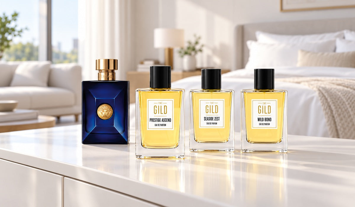Prestige Ascend, Seaside Zest, Wild Bond and Versace Dylan Blue on a white dresser in a bright white bedroom with a softly blurred white couch.